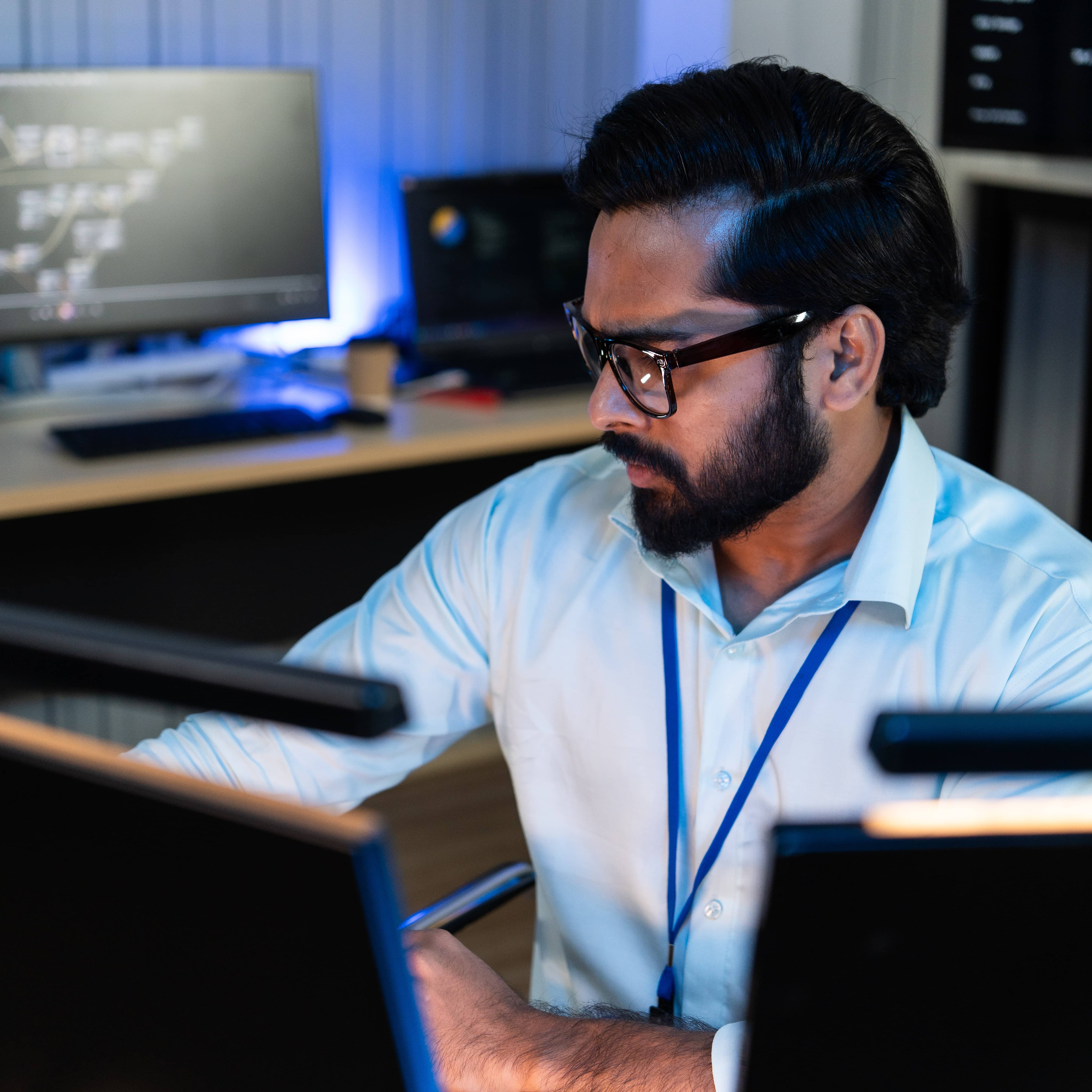 focused-professional-man-working-on-multiple-scree-2026-09-25-05-31-34-utc
